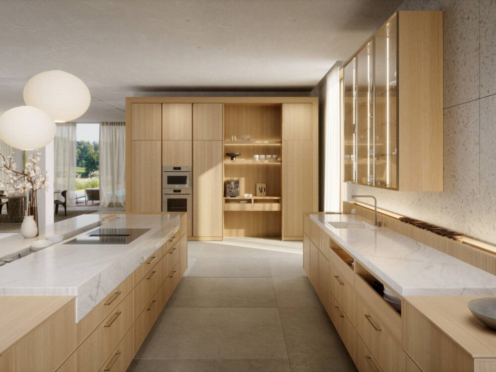 Häcker Küchen Design Inselküche Eiche elegant: Blick entlang der Kochinsel zur Schrankwand mit Backöfen